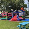 bouncy castle with soccer football baseball theme